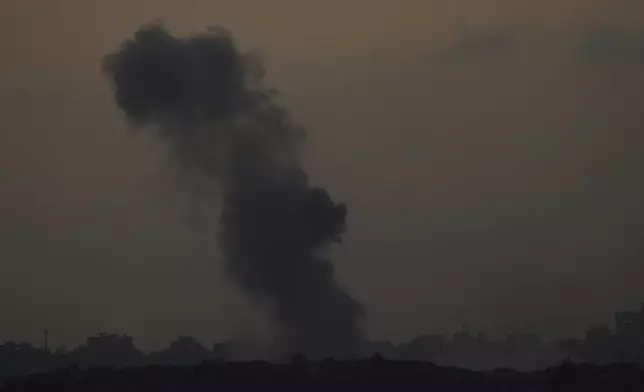 Smoke billows over the Gaza Strip following an Israeli bombardment, as seen from southern Israel, Tuesday, Sept.9, 2025. (AP Photo/Ariel Schalit)