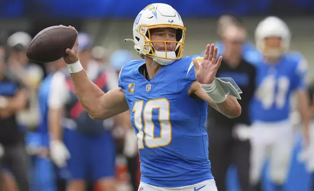Los Angeles Chargers quarterback Justin Herbert (10) throws a pass during the first half an NFL football game against the Denver Broncos, Sunday, Sept. 21, 2025, in Inglewood, Calif. (AP Photo/Gregory Bull)