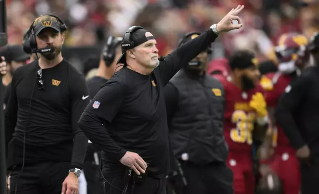 Washington Commanders Dan Quinn reacts on the sideline during the second half of NFL football game against the Las Vegas Raiders, Sunday, Sept. 21, 2025, in Landover, Md. (AP Photo/Nick Wass)