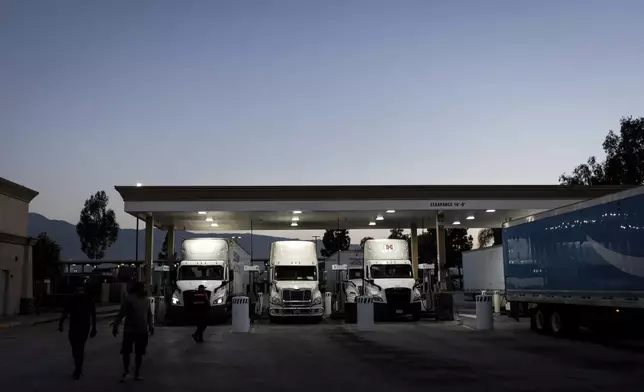 Trucks refuel at a gas station in Fontana, Calif., Wednesday, Sept. 3, 2025. (AP Photo/Jae C. Hong)