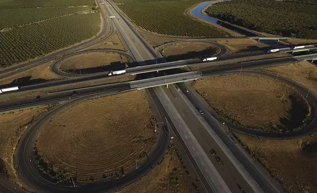 Freight trucks travel northbound on Interstate 5 Highway, Wednesday, Sept. 3, 2025, in Tracy, Calif. (AP Photo/Godofredo A. Vásquez)