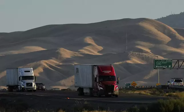 Freight trucks travel northbound on Interstate 5 Highway, Wednesday, Sept. 3, 2025, in Tracy, Calif. (AP Photo/Godofredo A. Vásquez)