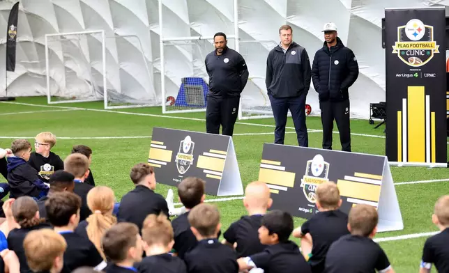 From left, former Pittsburgh Steelers player Jerome Bettis, Dan Rooney and Ike Taylor Tow speak with participants at the NFL Flag Football in Belfast, Northern Ireland, Thursday, Sept 25, 2025. (Peter Morrison/AP Content Services for the NFL)