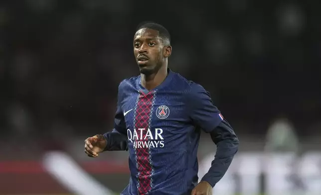 FILE - PSG's Ousmane Dembele during the League One soccer match Paris Saint-Germain against Angers at the Parc des Princes stadium, on Aug. 22, 2025 in Paris. (AP Photo/Aurelien Morissard, File)