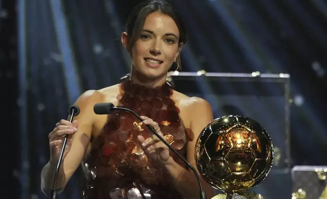 Barcelona's Aitana Bonmatí receives the 2025 Women's Ballon d'Or during the 69th Ballon d'Or awards ceremony at the Theatre du Chatelet in Paris, Monday, Sept. 22, 2025. (AP Photo/Thibault Camus)
