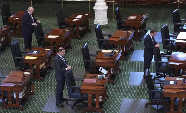 Texas state Sen. Robert Nichols, R-Jacksonville, left, Adam Hinojosa, R-Corpus Christi, center, and Brent Hagenbuch, R-Denton, right, pray with other senators as they prepare to debate a bills including one that would add new abortion restrictions, Wednesday, Sept. 3, 2025, in Austin, Texas. (AP Photo/Eric Gay)