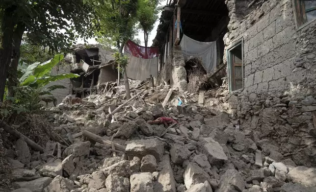 A village lies in rubble after Sunday night's powerful 6.0-magnitude earthquake that struck several provinces, in a remote valley in Kunar province, Afghanistan, Tuesday, Sept. 2, 2025. (AP Photo/Nava Jamshidi)