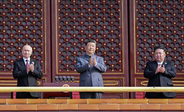 In this photo provided by the North Korean government, from right, North Korean leader Kim Jong Un, Chinese President Xi Jinping and Russian President Vladimir Putin attend a military parade marking the 80th anniversary of the end of World War II at Tiananmen Square in Beijing Wednesday, Sept. 3, 2025. The content of this image is as provided and cannot be independently verified. (Korean Central News Agency/Korea News Service via AP)