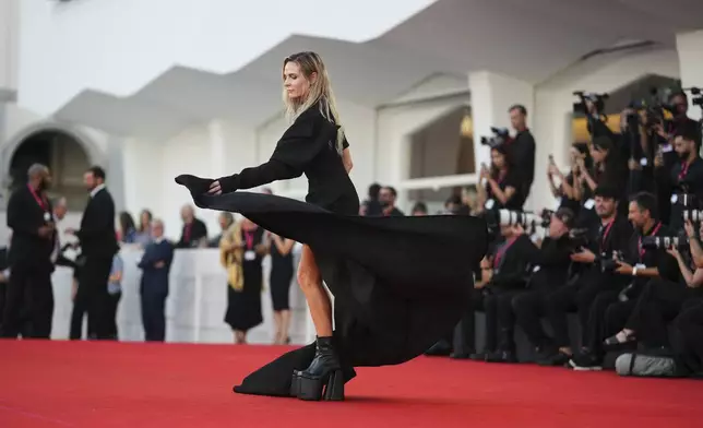Rebecca Ferguson poses for photographers at the red carpet for the film 'A House of Dynamite' during the 82nd edition of the Venice Film Festival in Venice, Italy, on Tuesday, Sept. 2, 2025. (Photo by Alessandra Tarantino/Invision/AP)