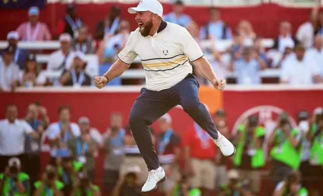 Europe's Shane Lowry celebrates after making the winning putt putt on the 18th hole during their singles match on the Bethpage Black golf course at the Ryder Cup golf tournament, Sunday, Sept. 28, 2025, in Farmingdale, N.Y. (AP Photo/Matt Slocum)