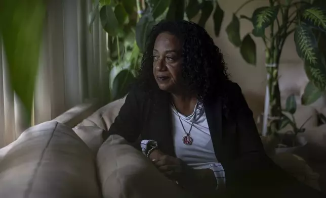 Delphine Cherry looks out from her favorite spot in her home Friday, Sept. 5, 2025, in Hazel Crest, Ill. (AP Photo/Carolyn Kaster)