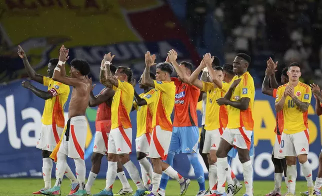 Players of Colombia celebrate their team's 3-0 victory over Bolivia at the end of a World Cup 2026 qualifying soccer match at Metropolitano stadium in Barranquilla, Colombia, Thursday, Sept. 4, 2025. (AP Photo/Fernando Vergara)