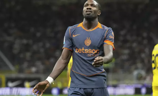 Inter Milan's Marcus Thuram reacts after he missed a scoring chance during a Serie A soccer match between Inter Milan and Sassuolo, at San Siro stadium in Milan, Italy, Sunday, Sept. 21, 2025. (AP Photo/Antonio Calanni)