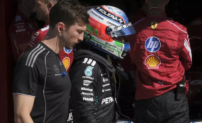 Mercedes driver Andrea Kimi Antonelli of Italy walks back to his pits after failing to complete the qualifying session ahead of the Formula One Dutch Grand Prix at the Zandvoort racetrack in Zandvoort, Netherlands, Saturday, Aug. 30, 2025. (AP Photo/Patrick Post, Pool)