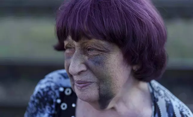 Tetiana Zaichikova, 69, stands on a platform of train station during evacuation in Lozova, Ukraine, Wednesday, Sept. 3, 2025. (AP Photo/Evgeniy Maloletka)