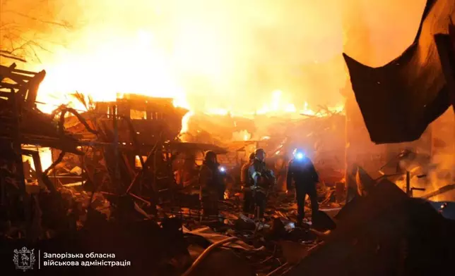 In this photo provided by the Zaporizhzhia regional military administration on Tuesday, Sept. 16, 2025, rescuers work on a site of a house destroyed by a Russian strike on residential neighbourhood in Zaporizhzhia, Ukraine. (Zaporizhzhia regional military administration via AP)