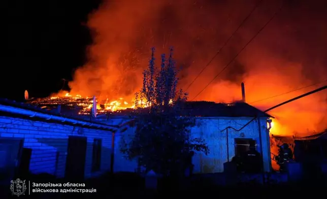 In this photo provided by the Zaporizhzhia regional military administration on Tuesday, Sept. 16, 2025, rescuers work on a site of a house destroyed by a Russian strike on residential neighbourhood in Zaporizhzhia, Ukraine. (Zaporizhzhia regional military administration via AP)