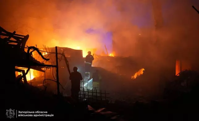 In this photo provided by the Zaporizhzhia regional military administration on Tuesday, Sept. 16, 2025, rescuers work on a site of a house destroyed by a Russian strike on residential neighbourhood in Zaporizhzhia, Ukraine. (Zaporizhzhia regional military administration via AP)