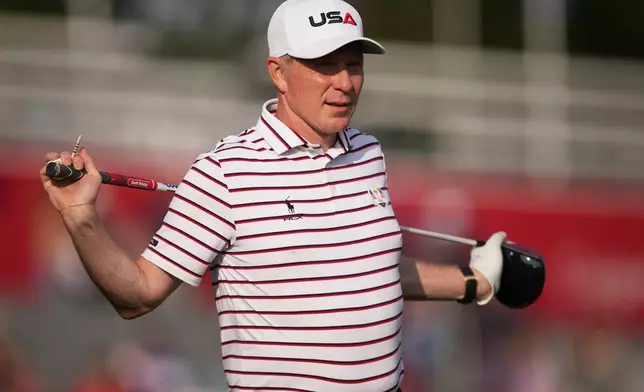 United States' Bobby Flay gets ready to play on the first hole during the celebrity Ryder Cup golf tournament, Wednesday, Sept. 24, 2025, on the Bethpage Black golf course, in Farmingdale, N.Y. (AP Photo/Matt Slocum)