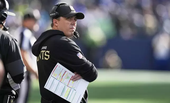 New Orleans Saints head coach Kellen Moore walks on the sideline in the second half of an NFL football game against the Seattle Seahawks, Sunday, Sept. 21, 2025, in Seattle. (AP Photo/Stephen Brashear)