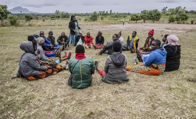 Smallholder farmers hold a meeting in Mulanje, southern Malawi, Tuesday, July 29, 2025. (AP Photo/Thoko Chikondi)
