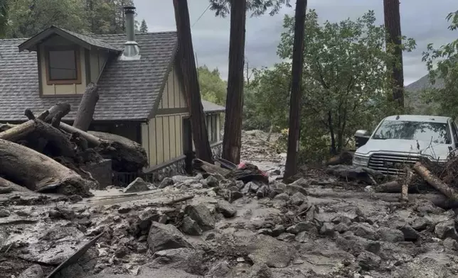This photo provided by the San Bernardino County Fire Department shows damage caused by mudslides after storms in Forest Falls, Calif., on Thursday Sept. 18, 2025. (San Bernardino County Fire Department via AP)