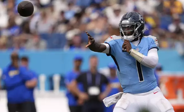 Tennessee Titans quarterback Cam Ward passes during the second half of an NFL football game against the Los Angeles Rams, Sunday, Sept. 14, 2025, in Nashville, Tenn. (AP Photo/George Walker IV)