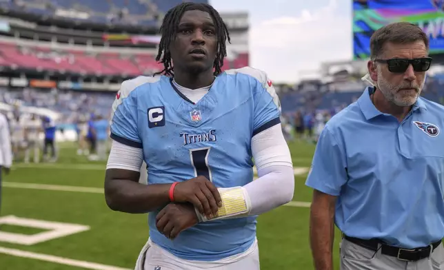 Tennessee Titans quarterback Cam Ward walks off the field after the Los Angeles Rams defeated the Titans in an NFL football game Sunday, Sept. 14, 2025, in Nashville, Tenn. (AP Photo/George Walker IV)