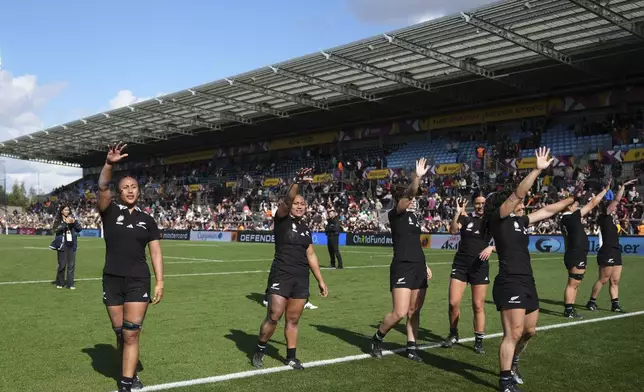 New Zealand's players celebrate following the Women's Rugby World Cup 2025 quarterfinal match between New Zealand and South Africa, in Exeter, England, Saturday, Sept. 13, 2025. (AP Photo/Alastair Grant)