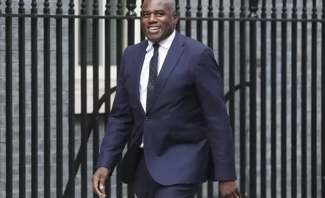 Newly appointed Justice Secretary and Deputy Prime Minister, David Lammy, arrives in Downing Street, London, where Prime Minister Keir Starmer is reshuffling his Cabinet following the resignation of Angela Rayner, Friday, Sept. 5, 2025. (James Manning/PA via AP)