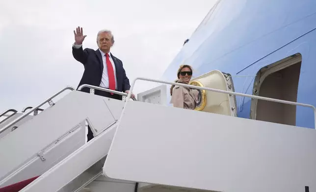 President Donald Trump and first lady Melania Trump board Air Force One, Tuesday, Sept. 16, 2025, in Joint Base Andrews, Md. (AP Photo/Evan Vucci)