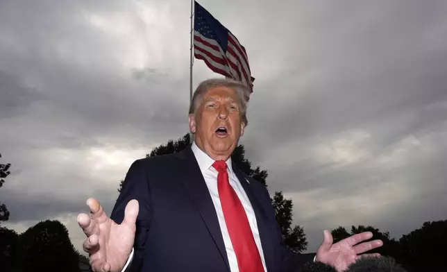 President Donald Trump speaks with reporters before departing on Marine One from the South Lawn of the White House, Tuesday, Sept. 16, 2025, in Washington. (AP Photo/Alex Brandon)