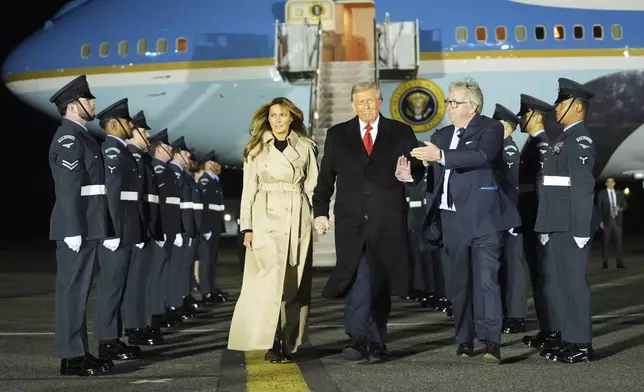President Donald Trump and first lady Melania Trump are greeted by The Viscount Hood, Lord-in-Waiting, center, right, as they arrive at Stansted Airport near London, Tuesday, Sept. 16, 2025. (AP Photo/Evan Vucci)