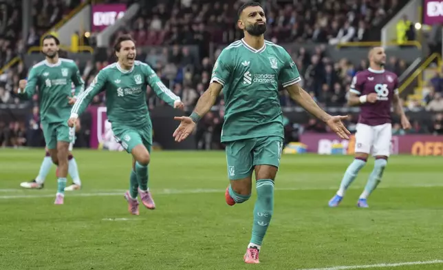 Liverpool's Mohamed Salah celebrate after scoring from a penalty kick during the Premier League soccer match between Burnley and Liverpool in Burnley, England, Sunday, Sept. 14, 2025. (AP Photo/Jon Super)