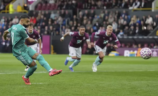 Liverpool's Mohamed Salah scores from a penalty kick during the Premier League soccer match between Burnley and Liverpool in Burnley, England, Sunday, Sept. 14, 2025. (AP Photo/Jon Super)