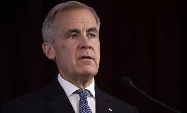 Prime Minister Mark Carney delivers opening remarks at the Liberal caucus in Edmonton on Wednesday Sept. 10, 2025. (Amber Bracken/The Canadian Press via AP)