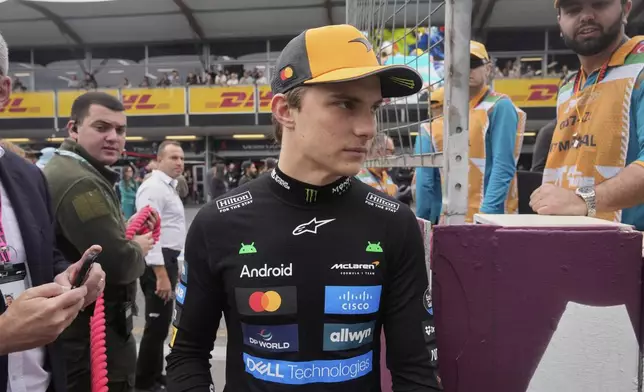 McLaren driver Oscar Piastri of Australia arrives at the starting grid for the Azerbaijan Formula One Grand Prix in Baku, Azerbaijan, Sunday, Sept. 21, 2025. (AP Photo/Darko Bandic)