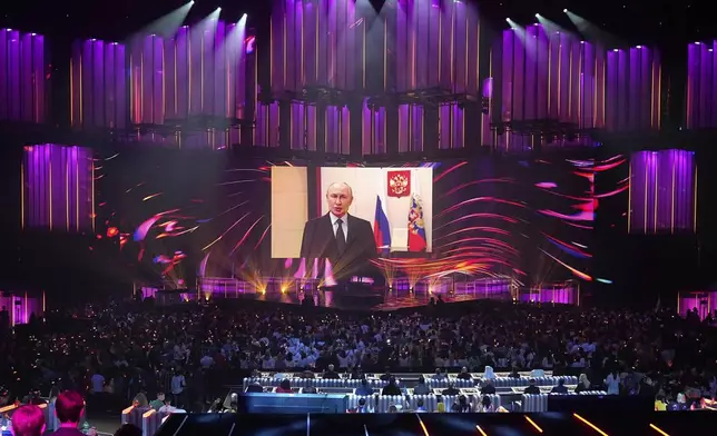 Russian President Vladimir Putin addresses participants and spectators of the International Music Competition "Intervision" via video link at the Live Arena outside Moscow, Russia, Saturday, Sept. 20, 2025. (AP Photo/Alexander Zemlianichenko)