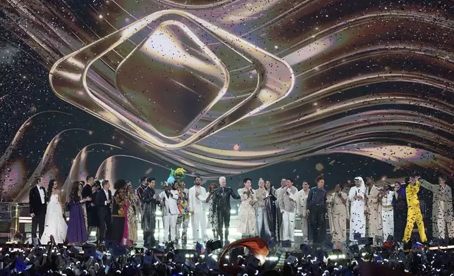 Participants of the International Music Competition "Intervision" sing together at the Live Arena outside Moscow, Russia, Sunday, Sept. 21, 2025. (AP Photo/Alexander Zemlianichenko)