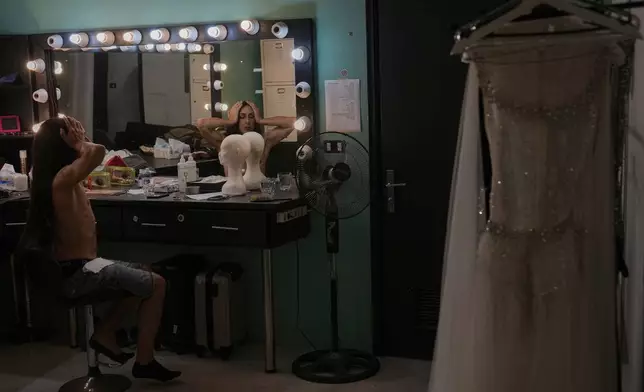 Alexandre Paulikevitch gets ready backstage before performing at a popular theatre in Beirut, Lebanon, Thursday, Sept. 11, 2025. (AP Photo/Hussein Malla)