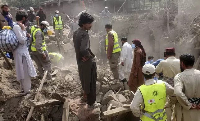 Civil defense workers, locals, and army soldiers clear rubble after a powerful 6.0-magnitude earthquake struck eastern Afghanistan on Sunday, killing many people and destroying villages, in Mazar Dara, Kunar province, Afghanistan, Tuesday, Sept. 2, 2025.(AP Photo/Hedayat Shah)
