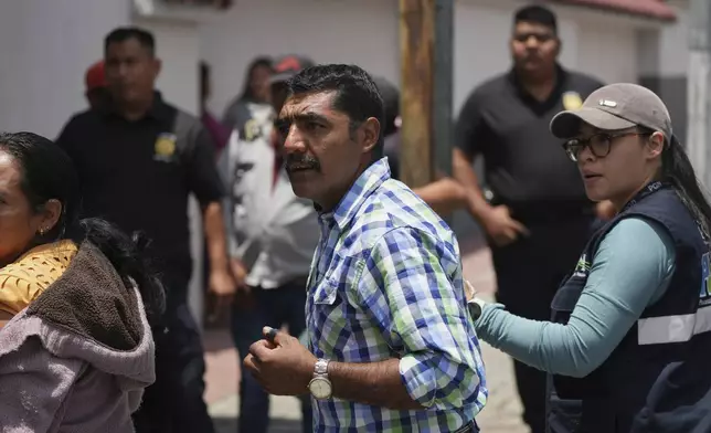 Gilberto Lopez, a relative of an unaccompanied minor deported from the United States, awaits updates outside La Aurora International Airport, in Guatemala City, Sunday, Aug. 31, 2025. (AP Photo/Moises Castillo)