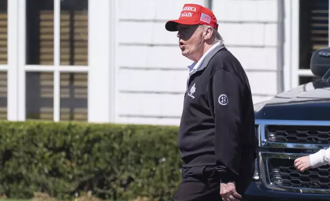 President Donald Trump walks at the Trump National Golf Club in Sterling, Va., Saturday, Aug. 30, 2025. (AP Photo/Manuel Balce Ceneta)