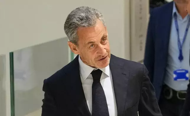 Former French President Nicolas Sarkozy arrives at the courthouse, in Paris, France, Thursday, Sept. 25, 2025. (AP Photo/Christophe Ena)
