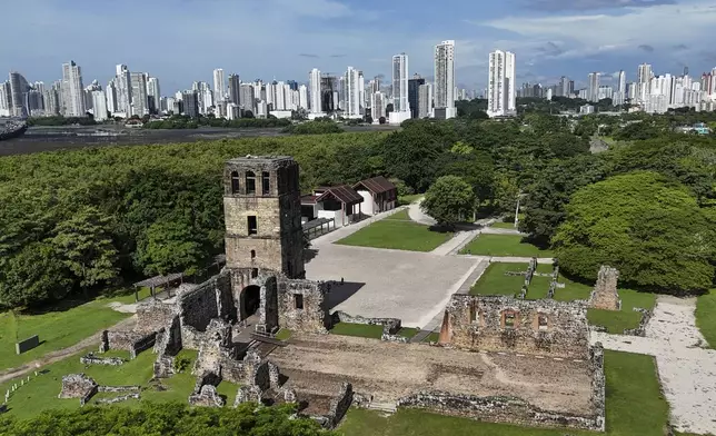 Ruins of the old bell tower in "Panama Viejo," or Old Panama, the first permanent Spanish settlement on the Pacific coast of the Americas, is backdropped by the modern skyline of Panama City, Wednesday, July 30, 2025. (AP Photo/Matias Delacroix)
