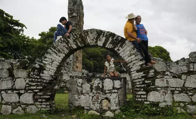 Visitors tour the ruins of Old Panama, the city's first colonial settlement founded in 1519 by Spanish conqueror Pedro Arias de Avila, in Panama City, Friday, Aug. 15, 2025.(AP Photo/Matias Delacroix)