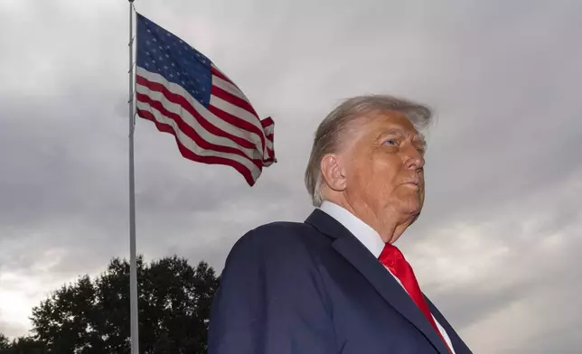 President Donald Trump speaks with reporters before departing on Marine One from the South Lawn of the White House, Tuesday, Sept. 16, 2025, in Washington. (AP Photo/Alex Brandon)