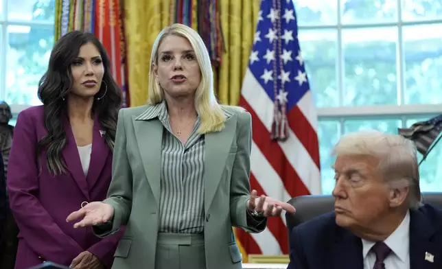 Attorney General Pam Bondi speaks as Homeland Security Secretary Kristi Noem, left, and President Donald Trump listen in the Oval Office of the White House, Monday, Sept. 15, 2025, in Washington. (AP Photo/Alex Brandon)