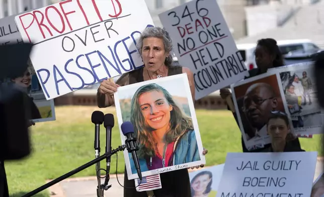 FILE - Nadia Milleron, parent of Samya Rose Stumo, one of the victims of the Boeing 737 Max crash in Ethiopia, holds her photograph as she speaks at a news conference on Capitol Hill, June 18, 2024, in Washington. ( AP Photo/Jose Luis Magana, File)