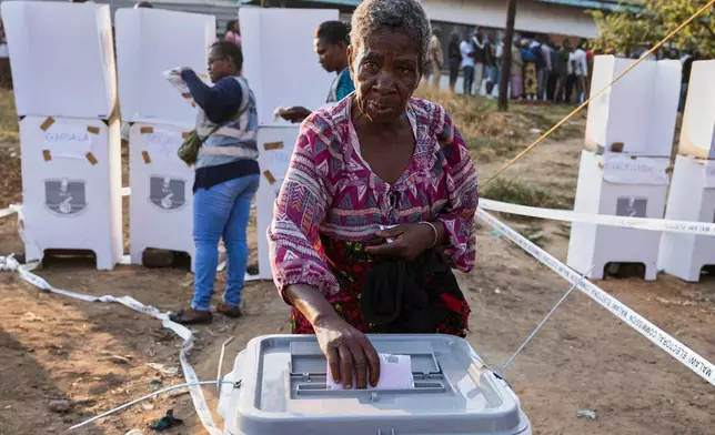 An elderly woman casts her vote during the elections, where the country will choose a president, lawmakers and local government representatives, in Blantyre, Malawi, Tuesday, Sept. 16, 2025. (AP Photo/Thoko Chikondi)